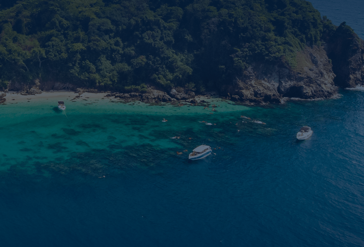 Tropical ocean with islands and a boat